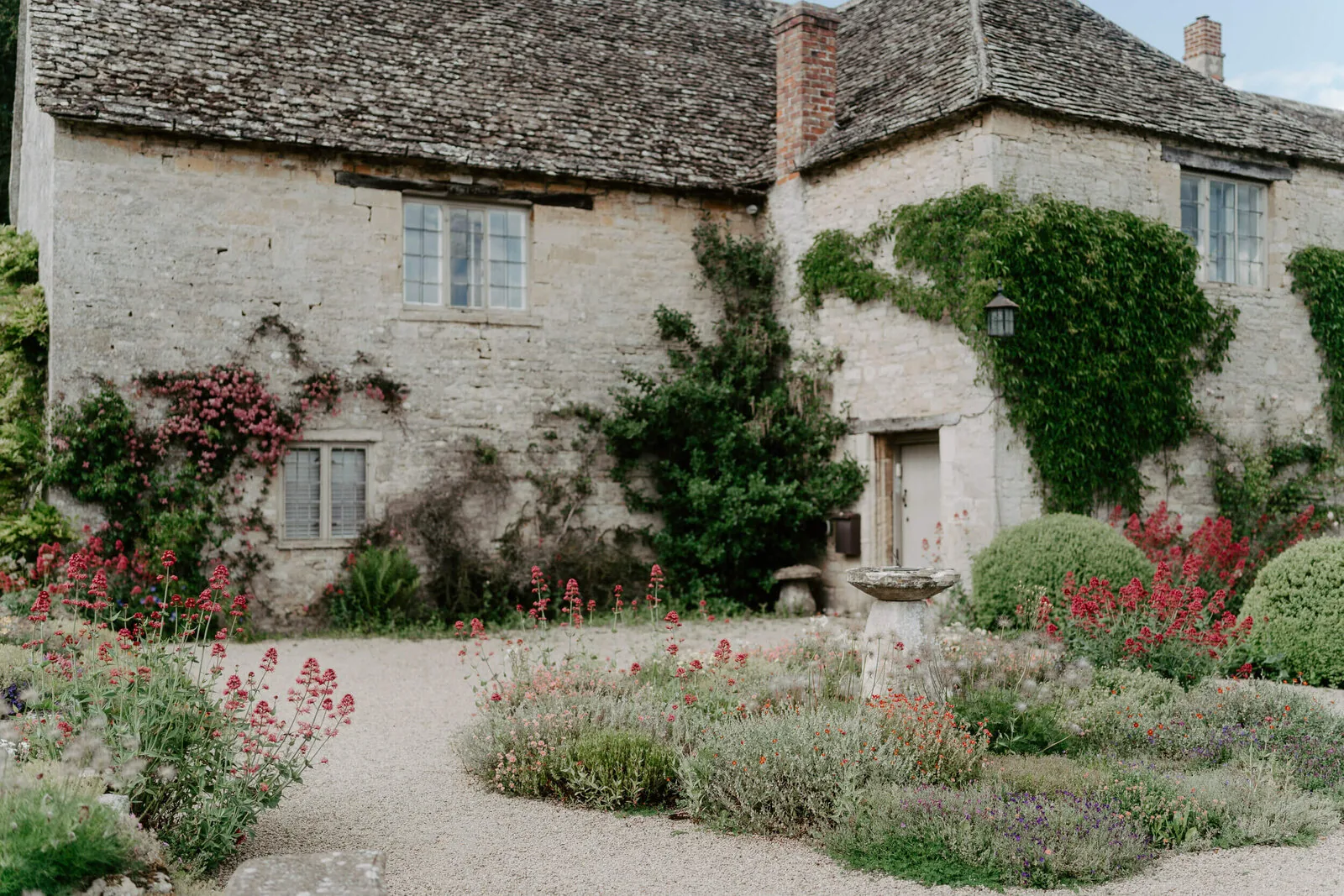 The gardens at Caswell House, bathed in Cotswolds sunshine